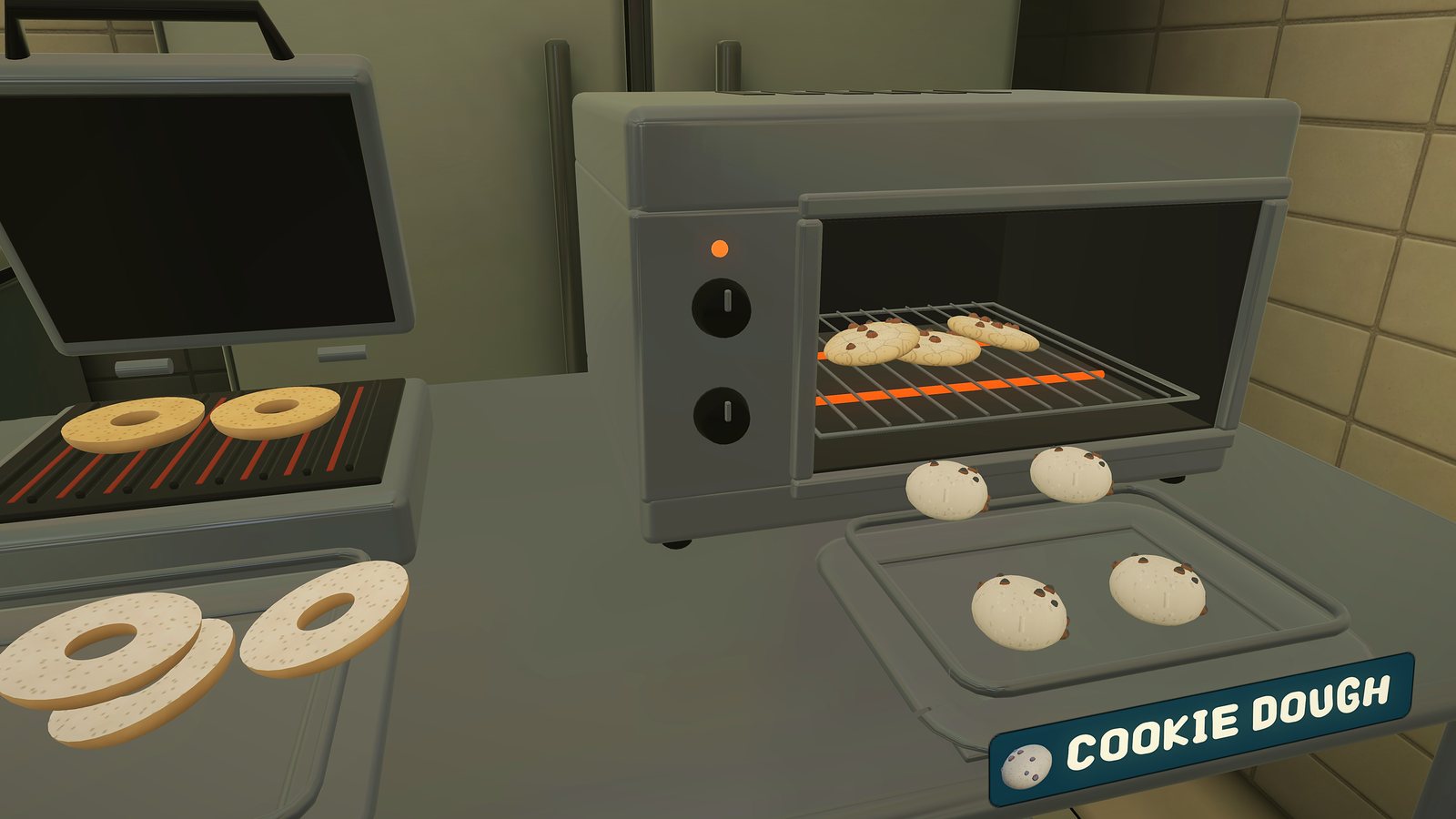 Cookies baking in the oven and bagels on the toaster
